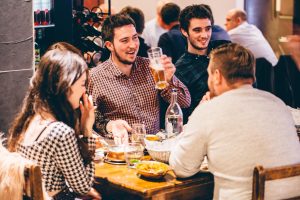 Colleagues laughing in The Dhabba, one of many Indian restaurants Merchant City Glasgow.